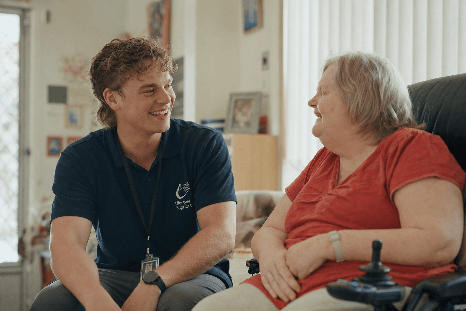 A support worker and an NDIS participant in conversation